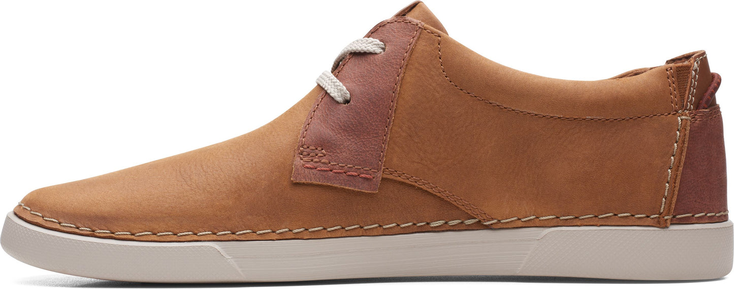 A tan-colored sneaker with an off-white sole and a brown stripe in the middle.