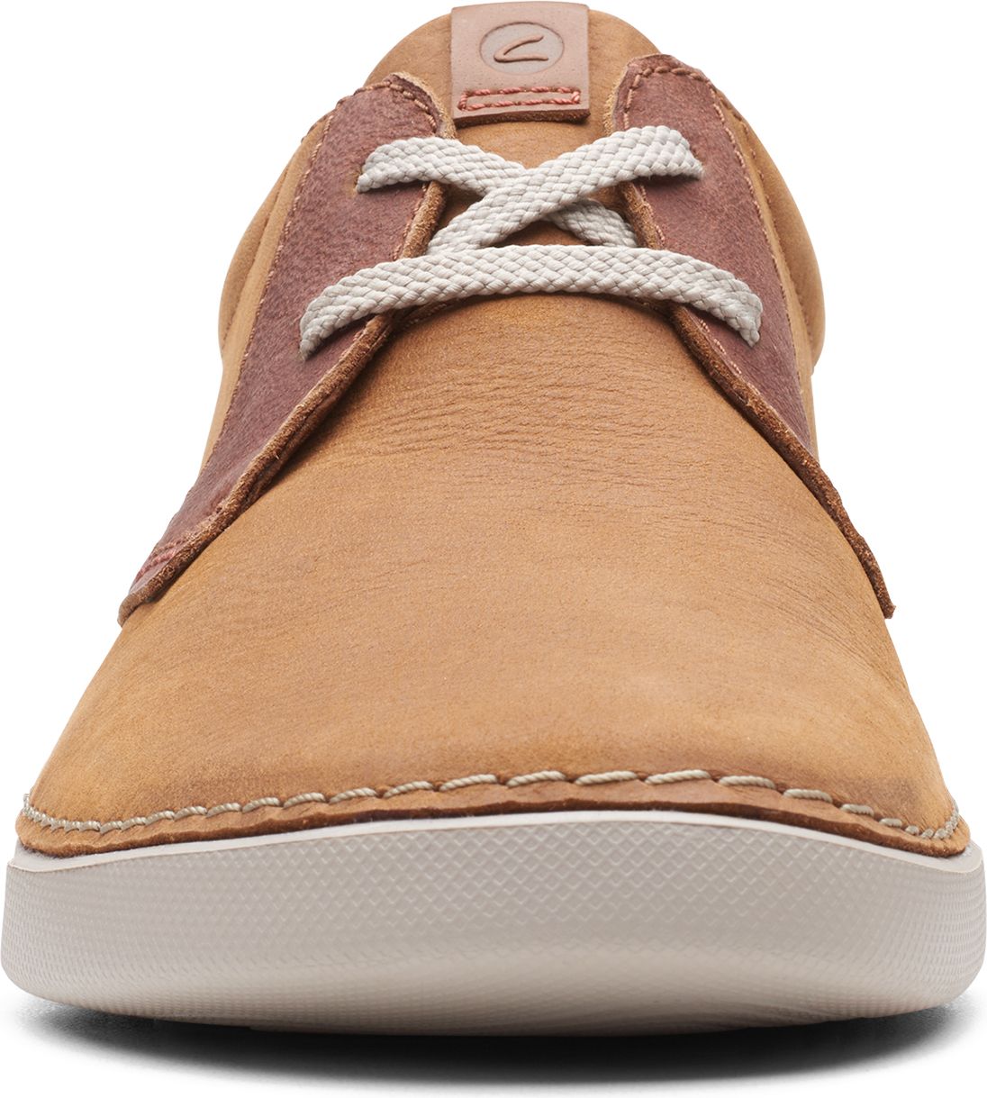 Tan suede shoe with white laces and white sole.