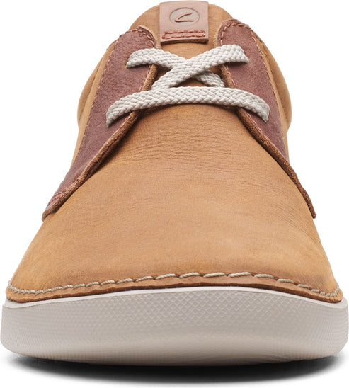 Tan suede shoe with white laces and white sole.