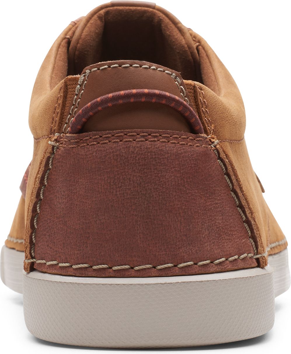 Tan leather lace-up sneaker with a dark brown heel and tan outsole.