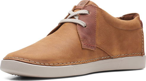 Tan casual leather shoe with white laces and sole.
