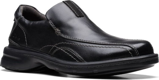 Black slip-on dress shoe with a rounded toe and visible stitching.