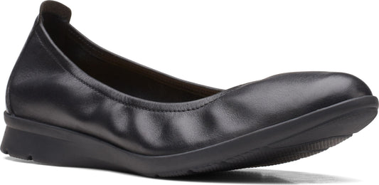 Black leather ballet flat with a low wedge heel.