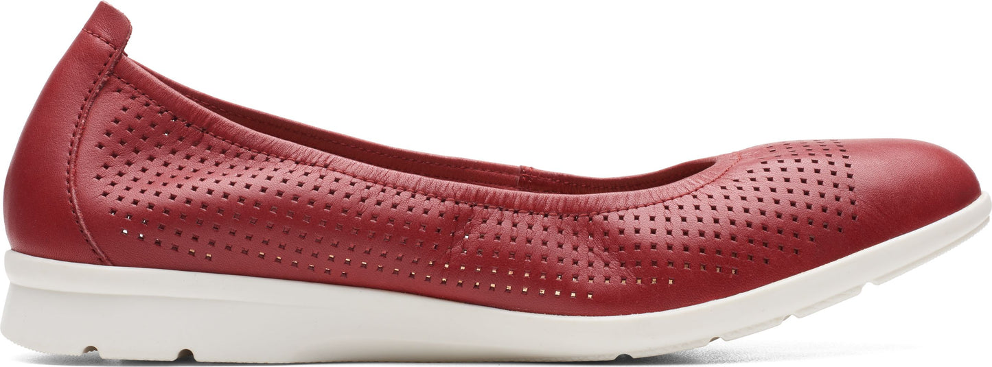 Red perforated ballet flat with white sole.
