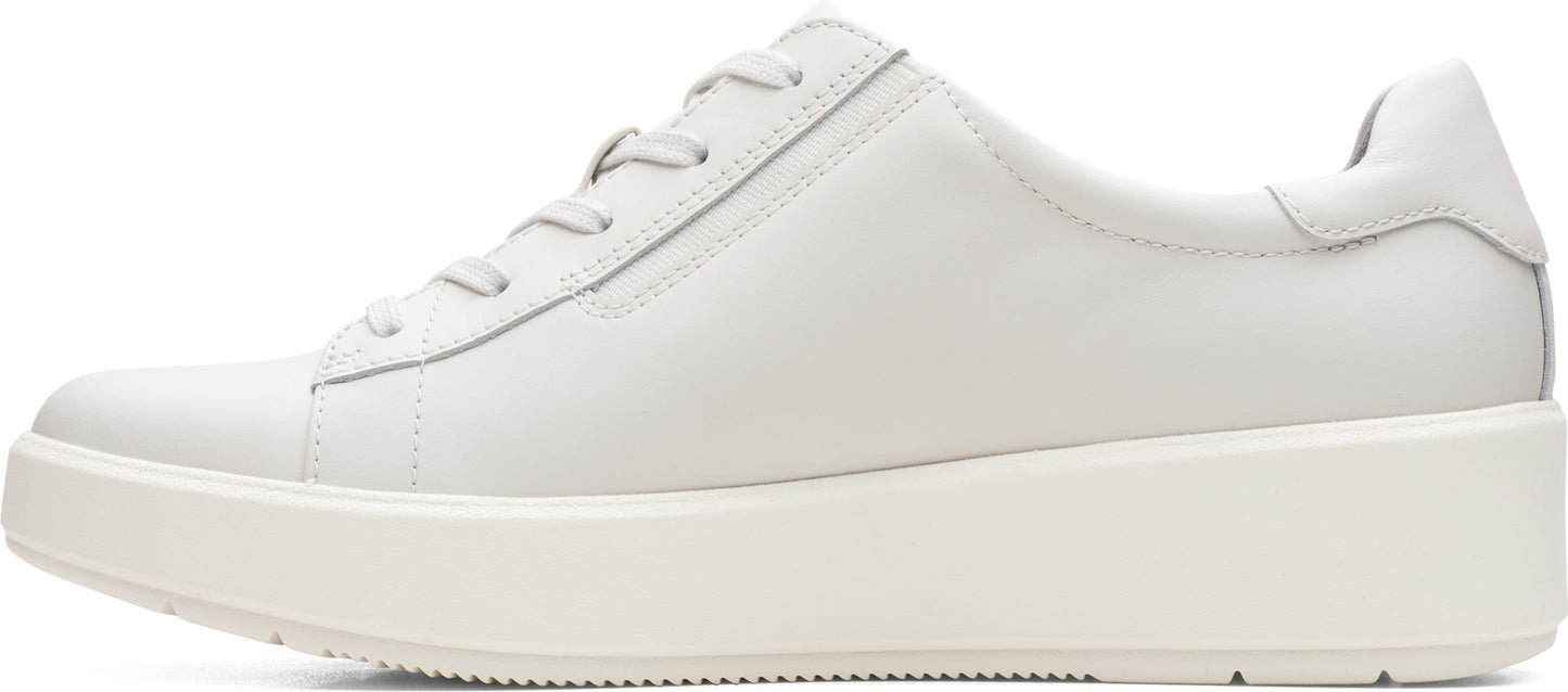 A white leather sneaker with a lace-up closure and a platform sole.