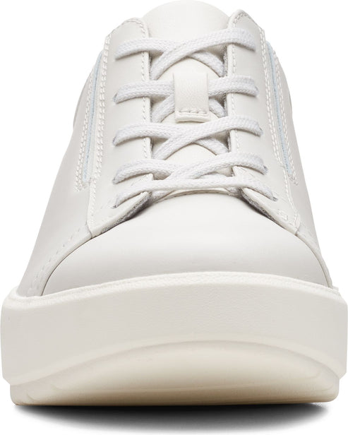 Front view of a white sneaker with white laces and a thick white sole.