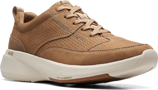 Tan suede sneaker with a white sole and lace-up closure.