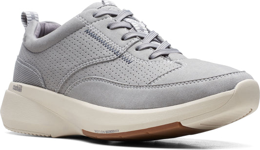 A gray sneaker with a white sole, featuring perforated detailing and laces.