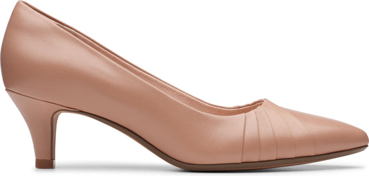 A woman's light pink, pointed-toe dress shoe with a slim heel.
