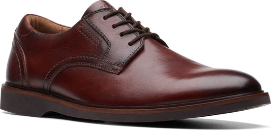 Brown leather dress shoe with dark brown laces and sole.
