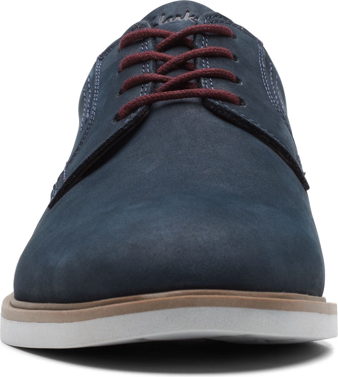 Front view of a blue leather dress shoe with red shoelaces and a white and brown sole.