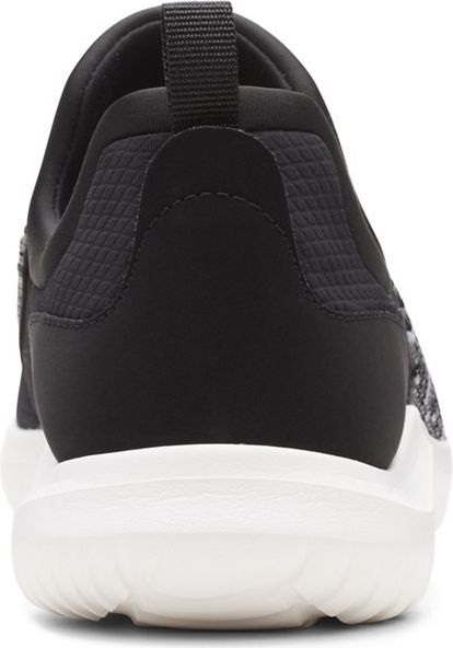Back of a slip-on sneaker with black and gray patterned fabric, black accents, a white sole, and a pull tab.