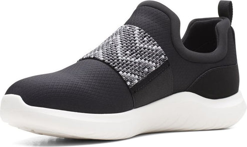 Black slip-on sneaker with a white sole and a gray and white knit band.