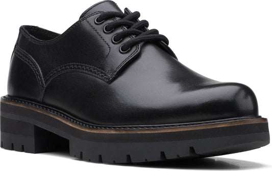 Black lace-up dress shoe with a thick lug sole.