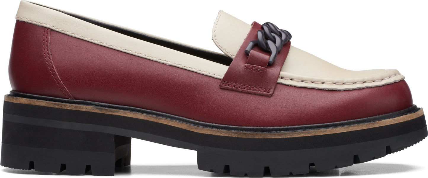 Two-tone loafer with a thick sole and metal chain detail.