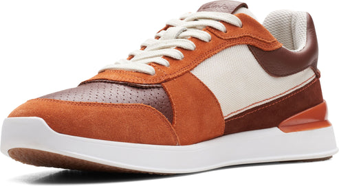 Low top, orange and brown sneaker with white laces and sole.