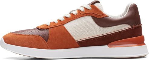 A brown leather sneaker with white laces and a white sole.