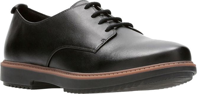 A black, leather oxford shoe with black laces and a thick sole.