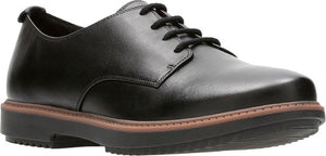 A black, leather oxford shoe with black laces and a thick sole.