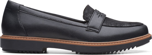 Black loafer with textured inlay on top.
