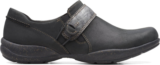 Black slip-on shoe with a velcro strap.