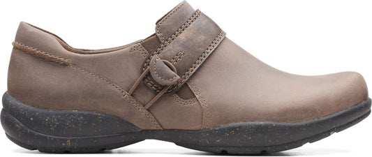 A taupe-colored casual clog with a hook-and-loop strap and a dark sole.