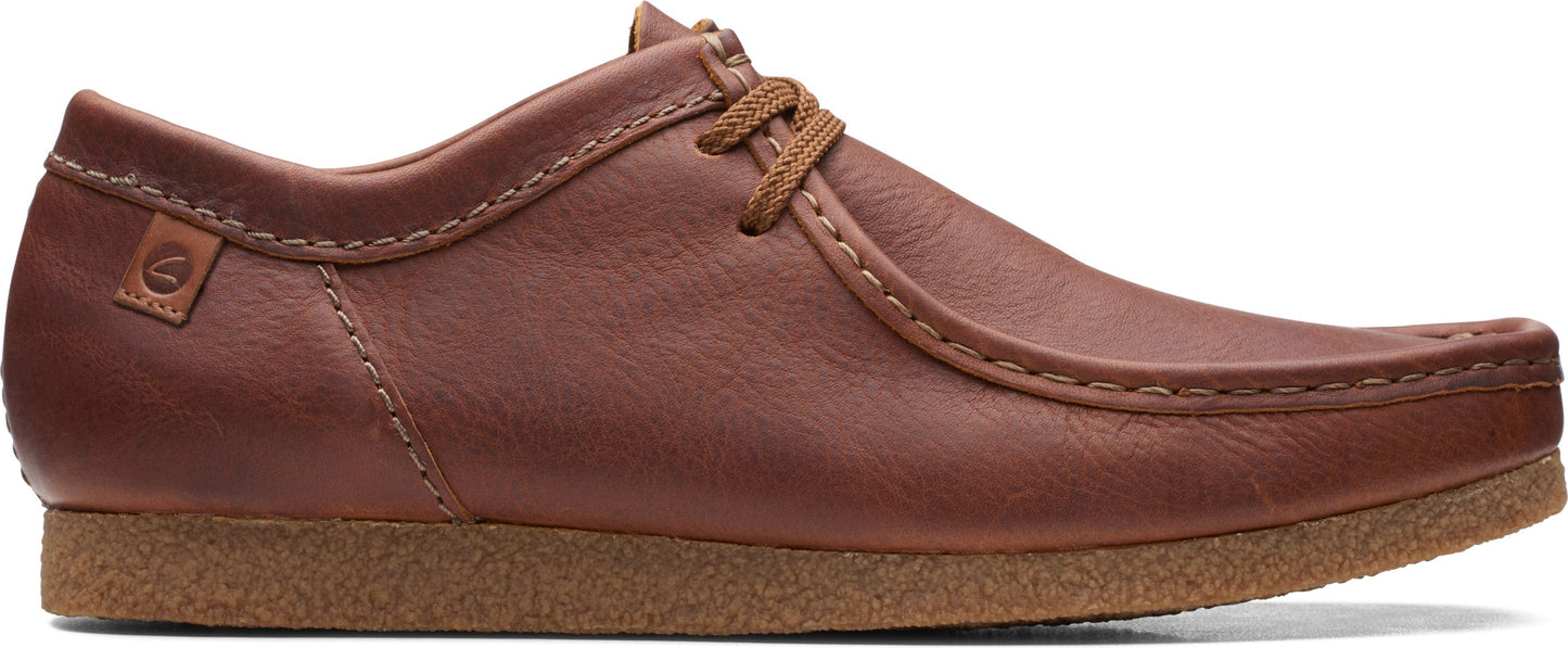 A brown leather shoe with a lace-up closure.
