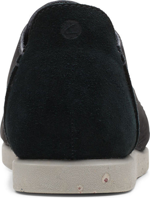 Back view of a black suede and leather slip-on shoe with a grey sole.