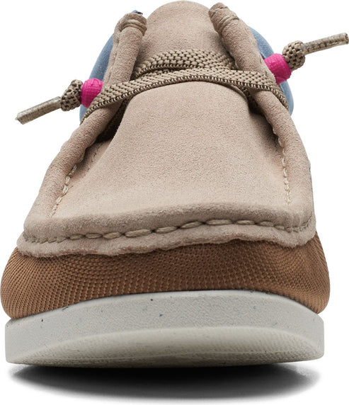 A close-up of a suede moccasin with tan laces featuring pink beads.