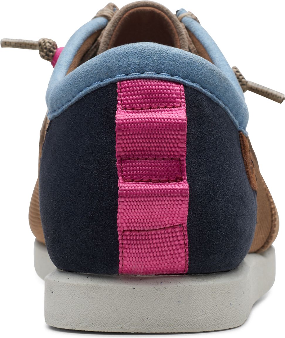 Back view of a tan suede shoe with a pink strap on a blue and navy heel.