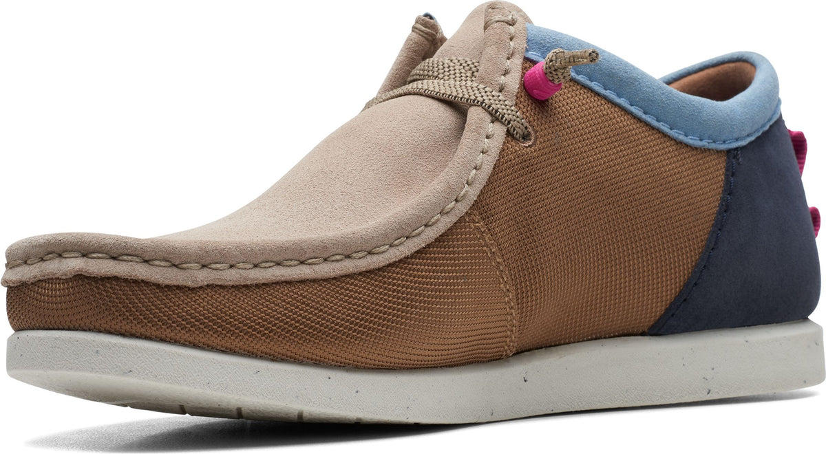 Low profile lace-up shoe featuring beige suede and tan canvas upper with blue collar and dark blue heel panel, atop a white speckled sole.