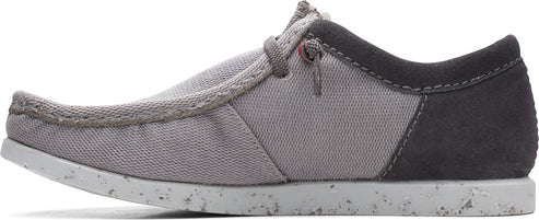 A low-profile gray shoe with gray laces.