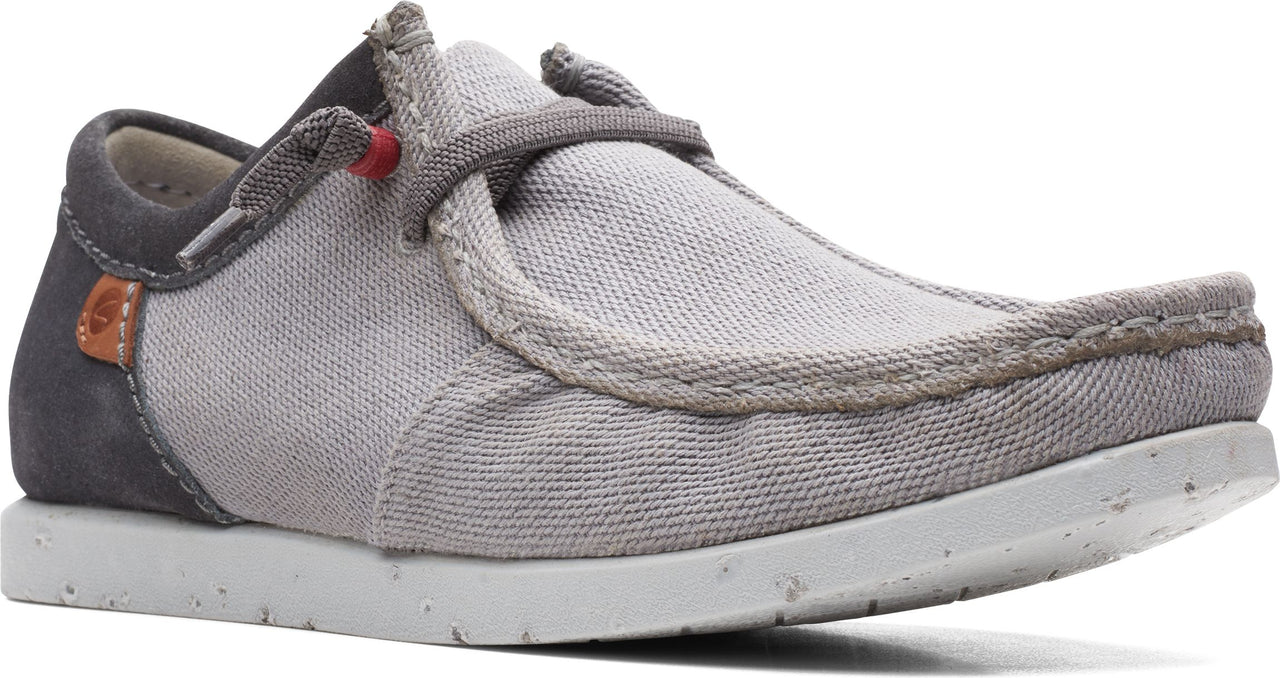 Gray canvas slip-on shoe with gray suede heel counter and white sole.