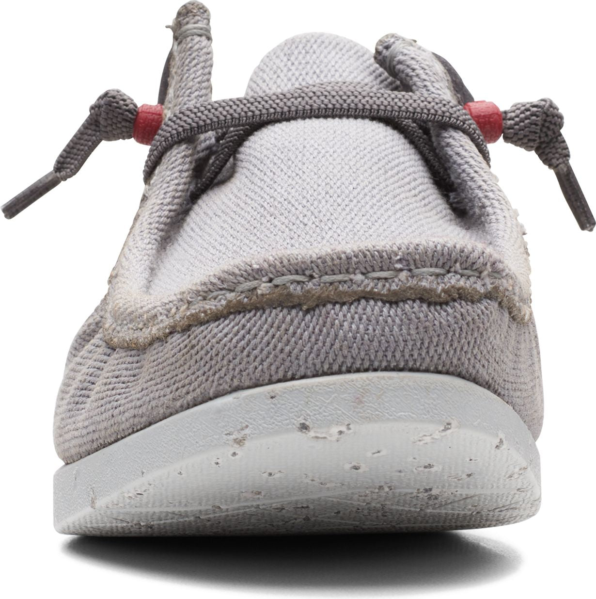 Gray canvas shoe with gray laces and a speckled white sole, viewed from the front.