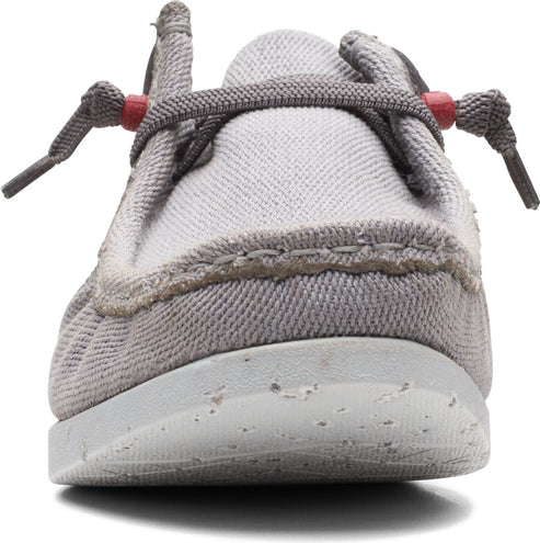 Gray canvas shoe with gray laces and a speckled white sole, viewed from the front.