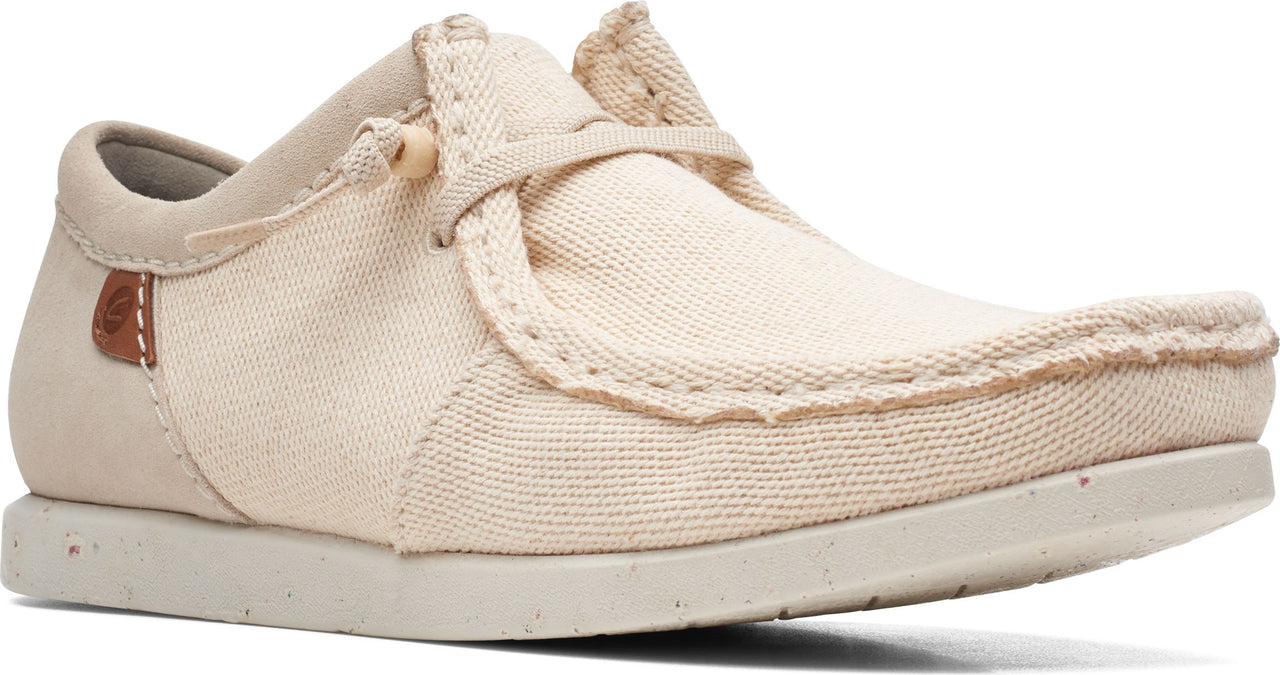 Beige canvas casual shoe with laces and a flat sole.