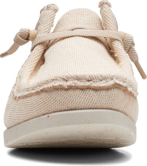 Beige canvas slip-on shoe with knotted laces and fringed trim.