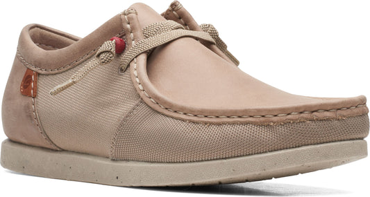 Beige casual moccasin shoe with canvas and leather upper, and flat sole.