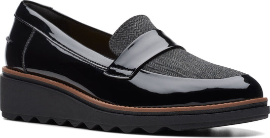 Black patent leather wedge loafer with tweed vamp and stacked sole.
