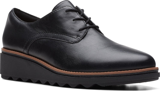 Black leather platform oxford with tonal laces and sawtooth sole.