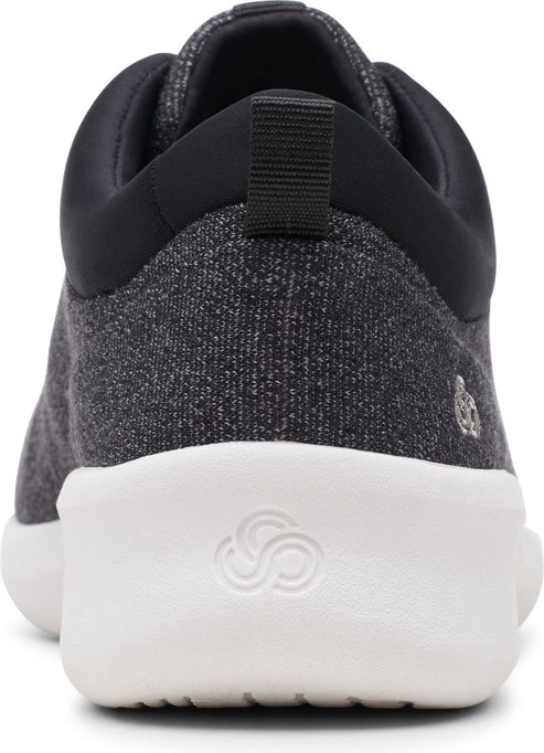 Back of a heather grey sneaker with a white sole and a black heel.