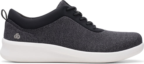 A gray shoe with a black collar and white sole.