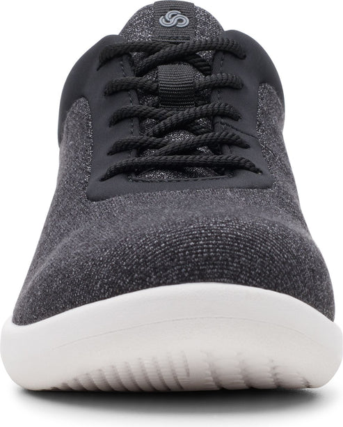 Close-up of a gray textile sneaker with black laces and a white sole.