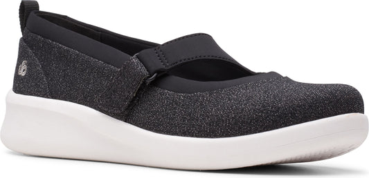 A dark gray Mary Jane style shoe with a white sole.