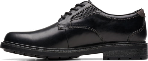 A black dress shoe with black laces.