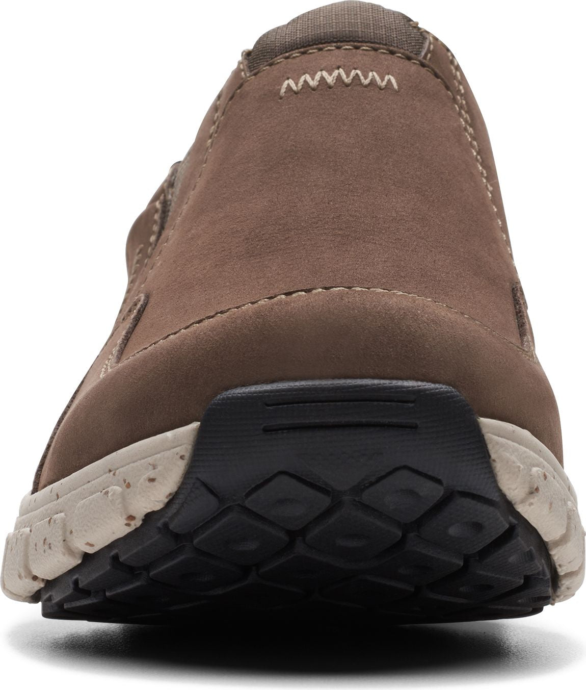 Close-up of brown slip-on shoe with black and beige sole.