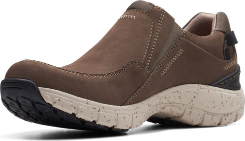 Slip-on brown leather shoe with beige and black speckled sole and elastic side inserts.