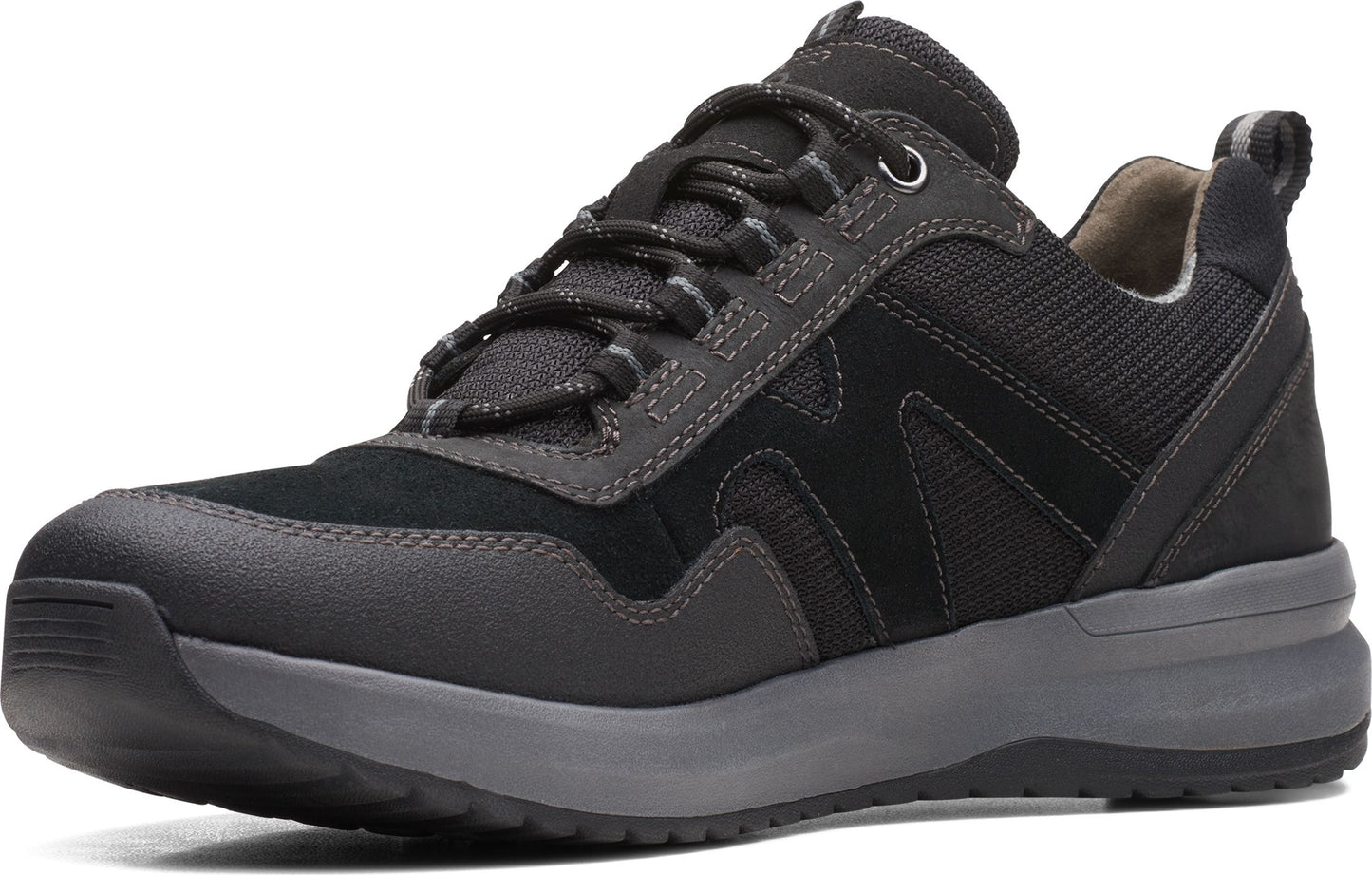 A black, low-cut hiking shoe with black laces and a gray sole.