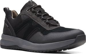 A charcoal low-top sneaker features a suede toe, a lug sole, cord laces, and padded collar and tongue.