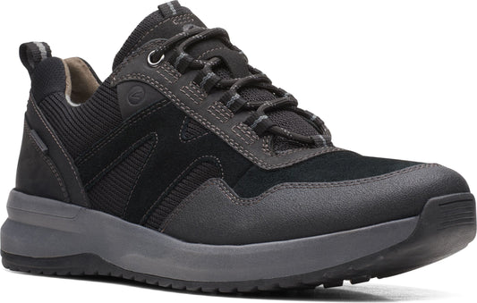 A charcoal low-top sneaker features a suede toe, a lug sole, cord laces, and padded collar and tongue.